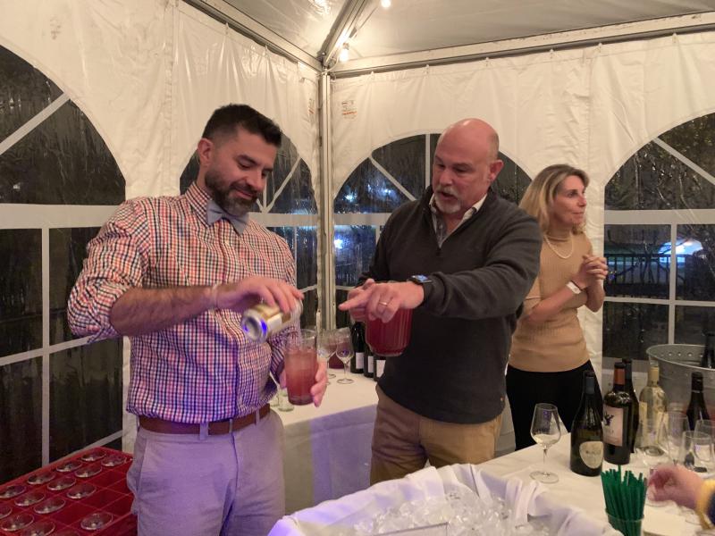 Enjoying specialty cocktails are guests Andrew Dickinson, left, and Paul Karp.